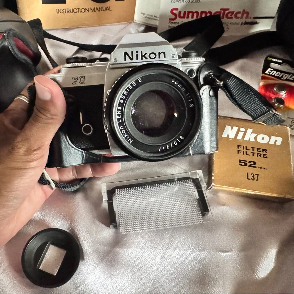 FG Nikon 35mm SLR camera with accessories